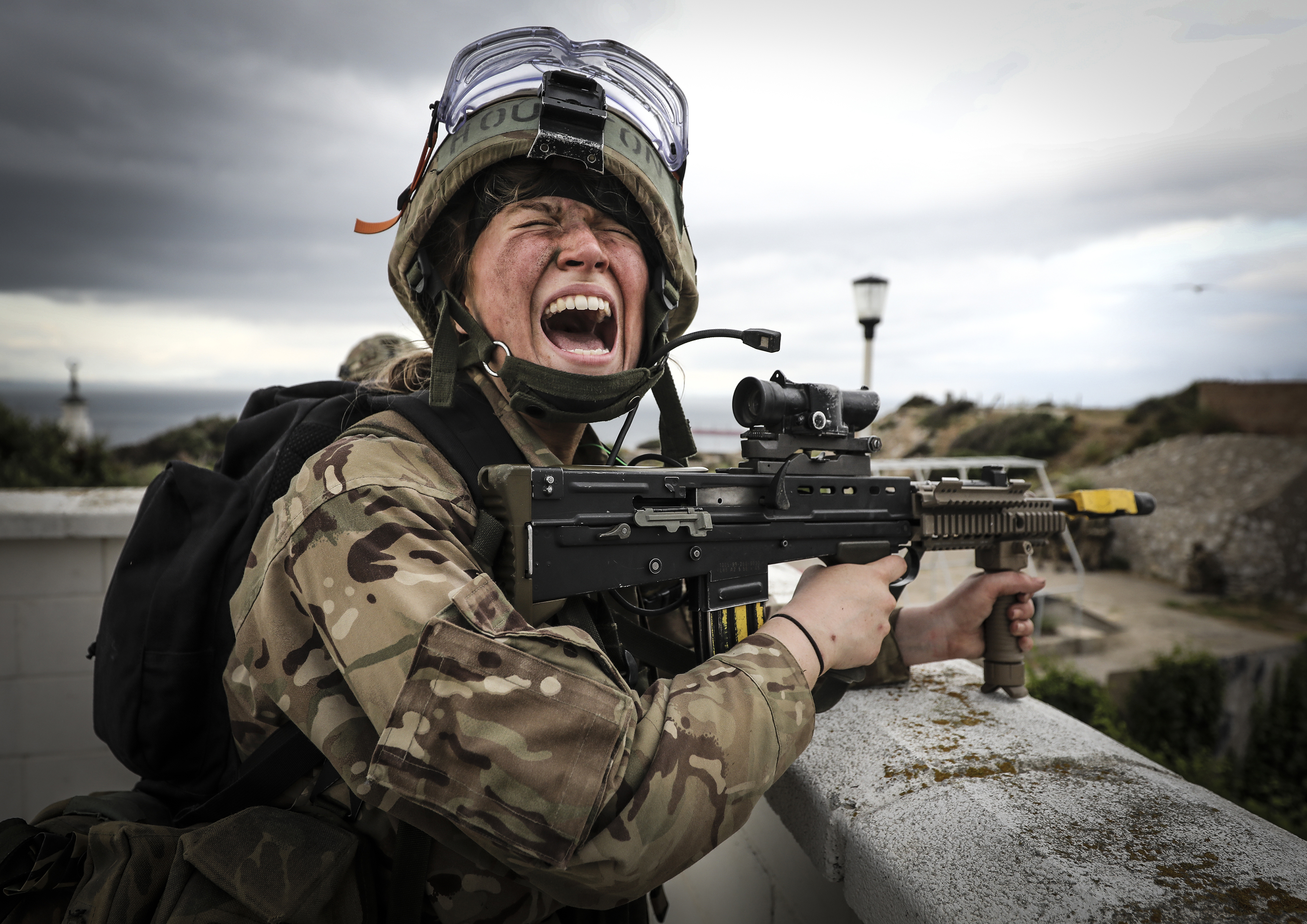 Personnel shouting with rifle.
